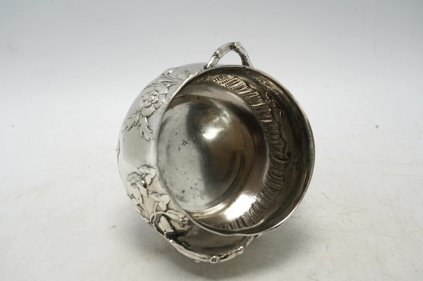 A late Victorian silver two handled sugar bowl, by Carrington & Co, London 1900, 7.3oz. Condition - poor to fair